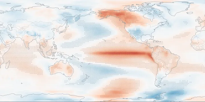 Global map of December temperature in El Ni&ntilde;o years minus climatology: warm along the equatorial eastern Pacific and over Alaska and western Canada, dotted where significant